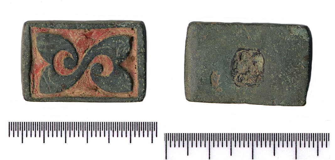 Cast copper-alloy Button-and-loop fastener of Wild's Class VIa. Rectangular, with large sub-square scar on reverse…