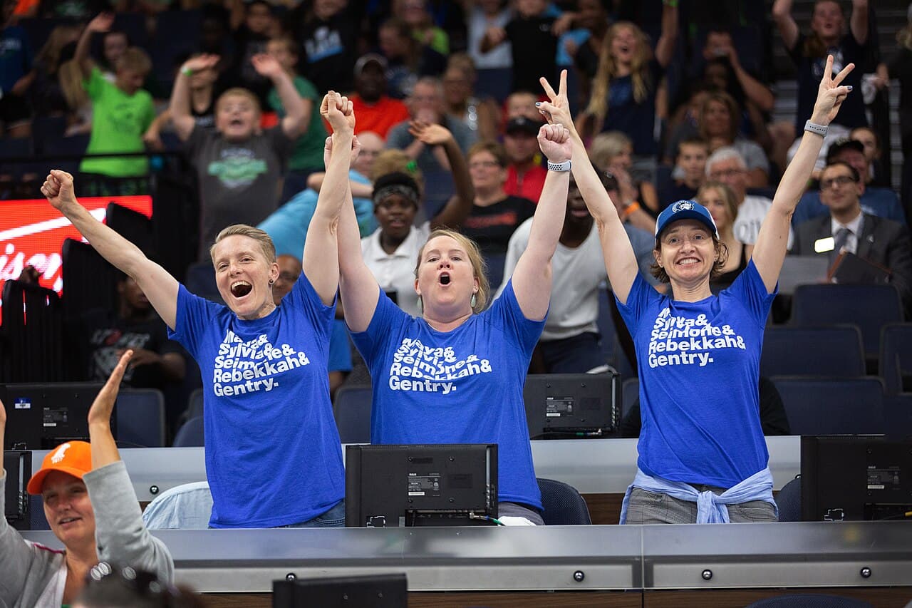 Cheering Minnesota Lynx fans wearing t-shirts with Lindsay Whalen's Instagram persona Gentry