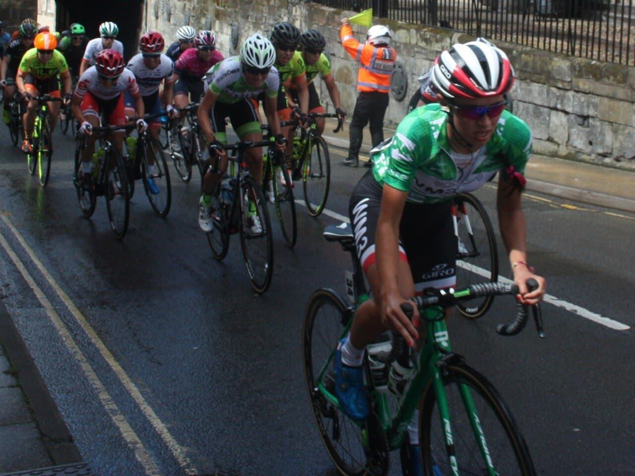 Kasia Niewiadoma, in the race leader's green jersey, rides through Warwick with the peloton during stage 3 of the 2017…