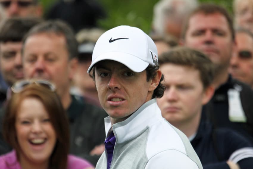 Rory McIlroy amidst crowd of onlookers during a practice day for the 2013 BMW PGA Championship at Wentworth Club.