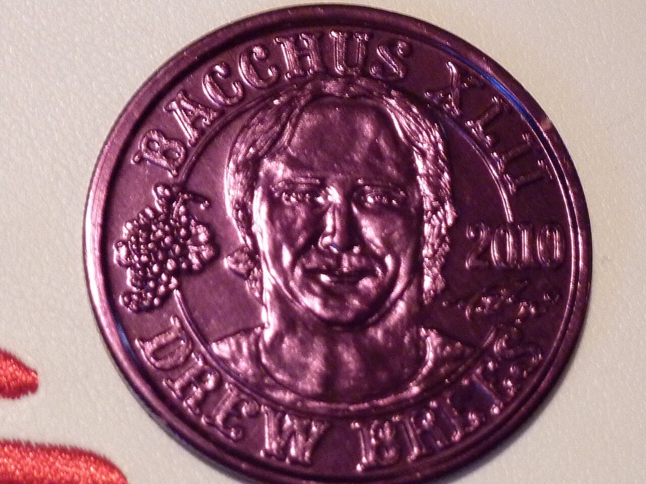 The American football player Drew Brees coined as Bacchus. Token of Mardi Gras.