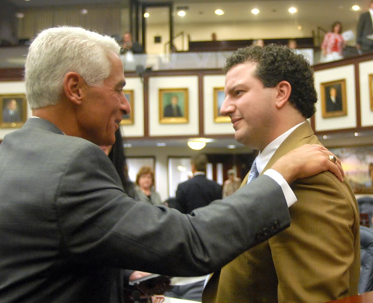 Rep. Jimmy Patronis, R-Panama City, right, is greeted by Gov Charlie Crist, left, on the House floor May 1, 2008, in…