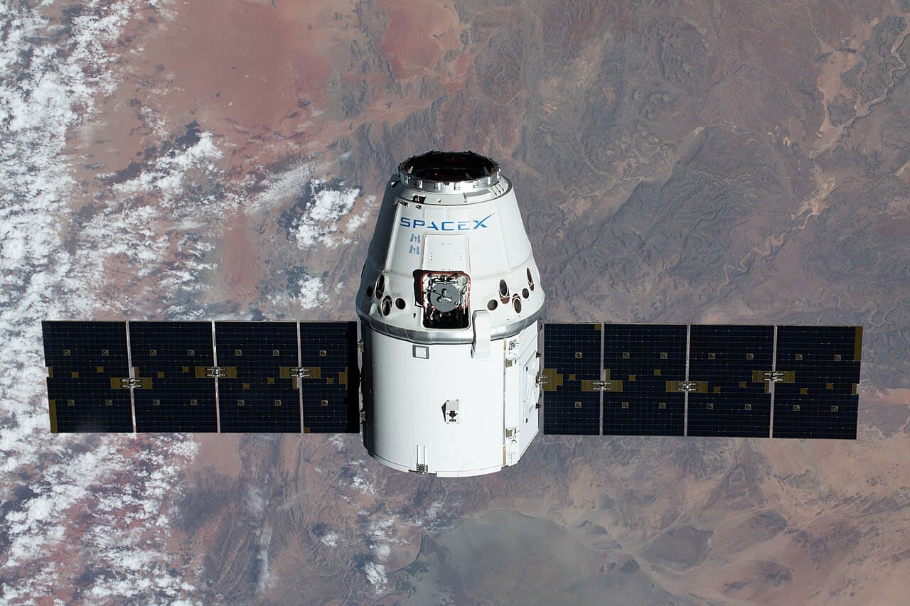 SpaceX CRS-20 mission. The SpaceX Dragon resupply ship is pictured approaching the International Space Station as both…