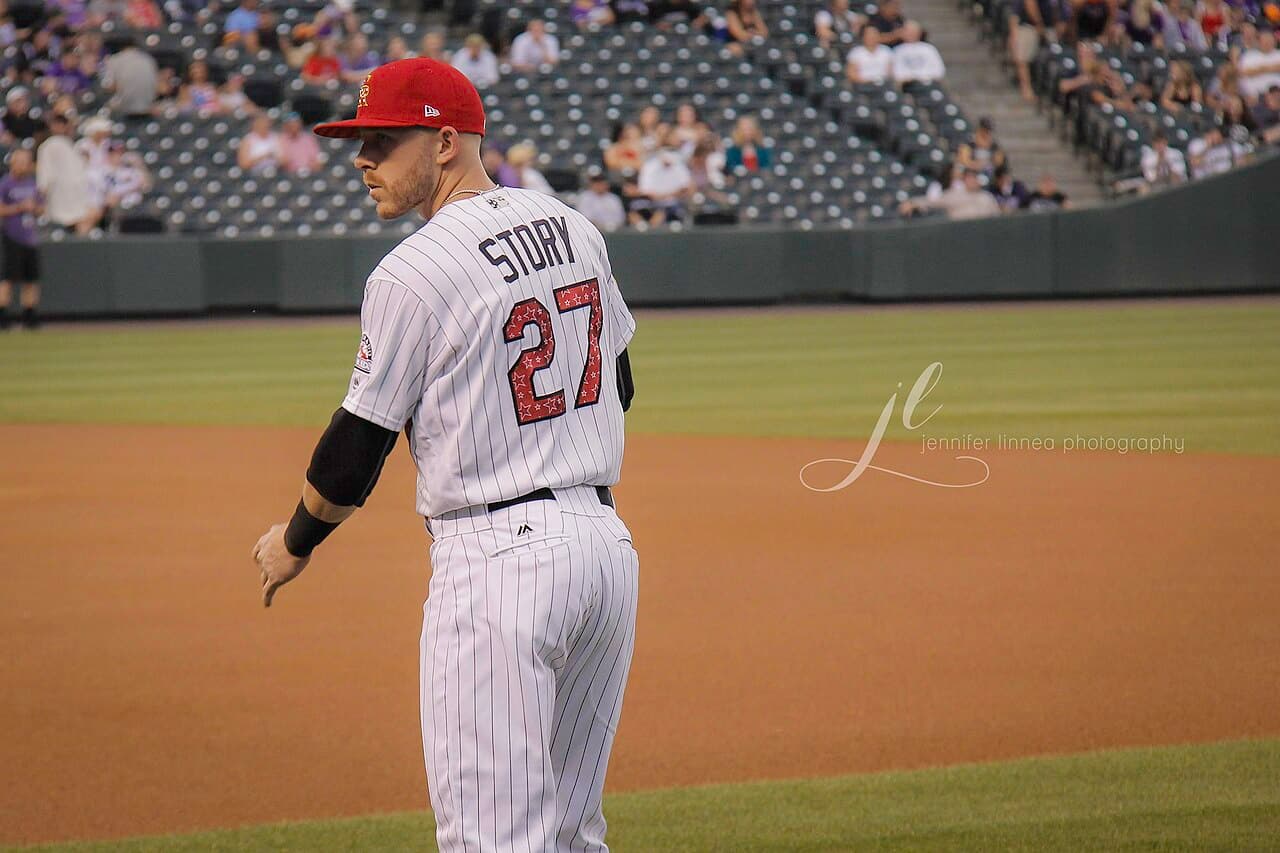 Trevor Story looking back at the fans while warming up before the Rockies vs. Giants 4th of July game.
