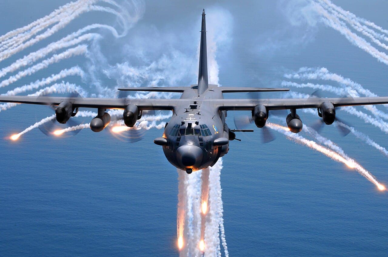 An AC-130H gunship from the 16th Special Operations Squadron, Hurlburt Field , Florida, jettisons flares as an…