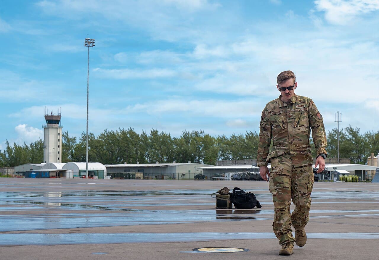 U.S. Air Force Maj. Brady Knutson, 9th Airlift Squadron pilot, walks on the flightline at Diego Garcia, British Indian…