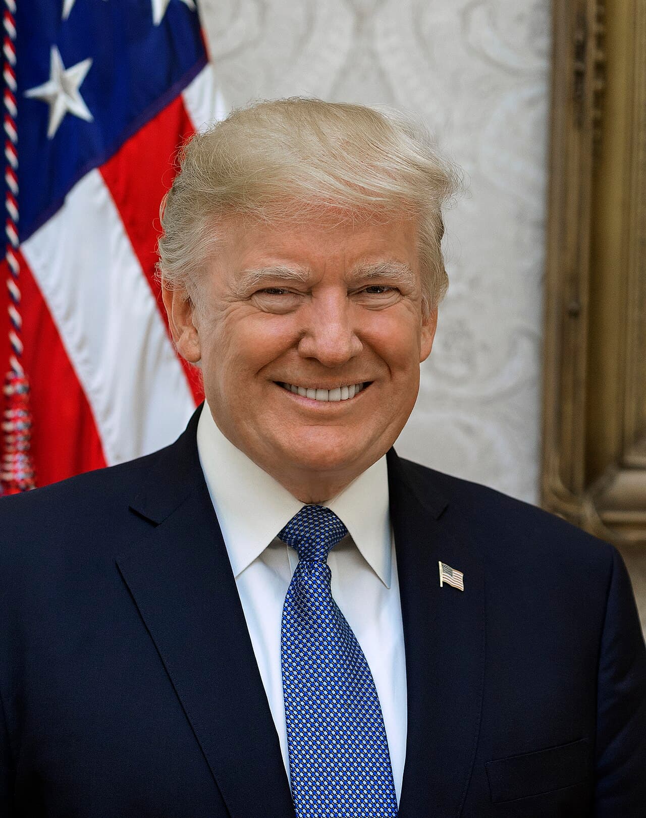 President Donald Trump poses for his official portrait at The White House, in Washington, D.C., on Friday, October 6,…