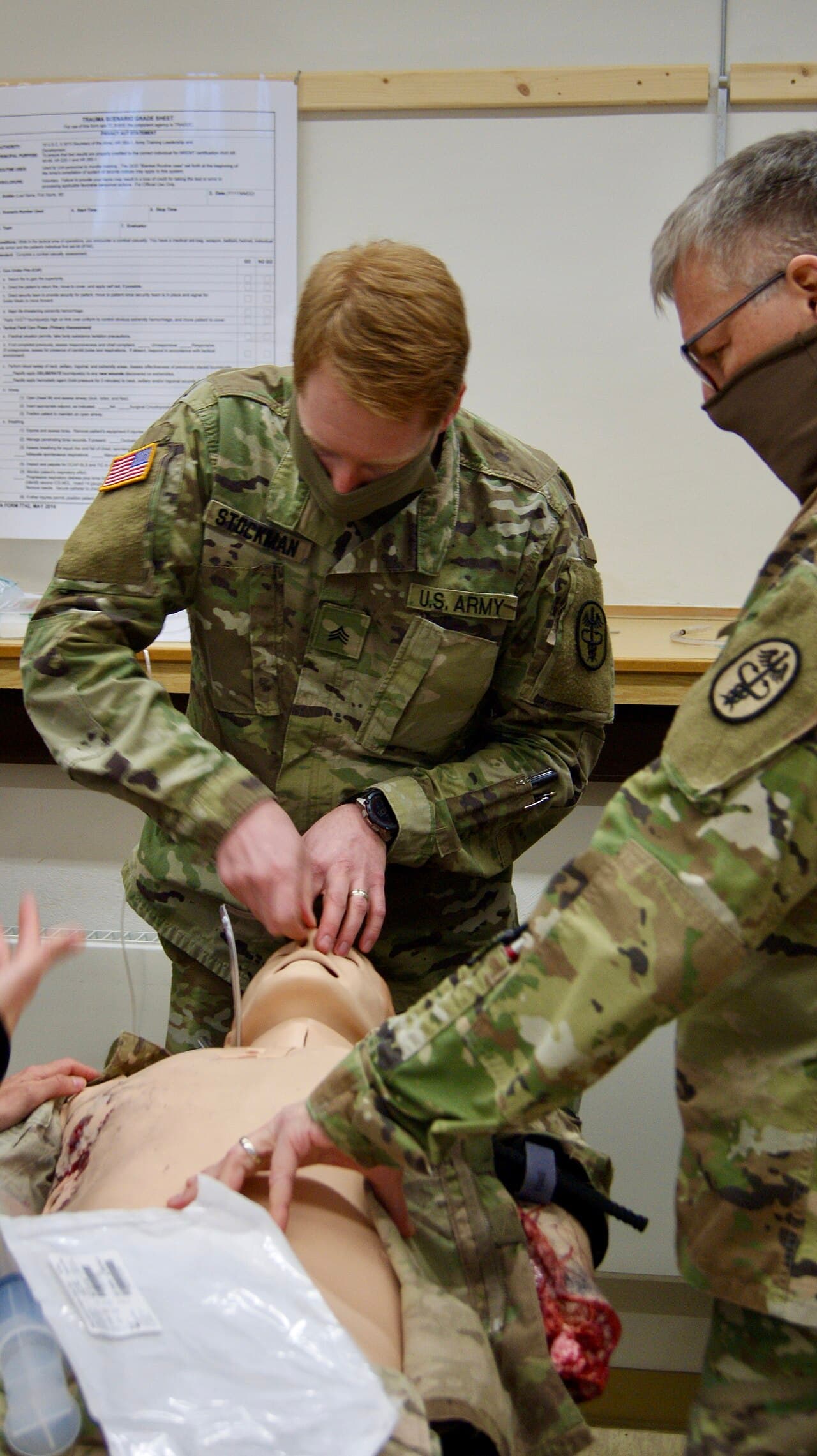 U.S. Soldiers, assigned to the U.S. Army Medical Department Activity Bavaria, examine a patient’s airway during…