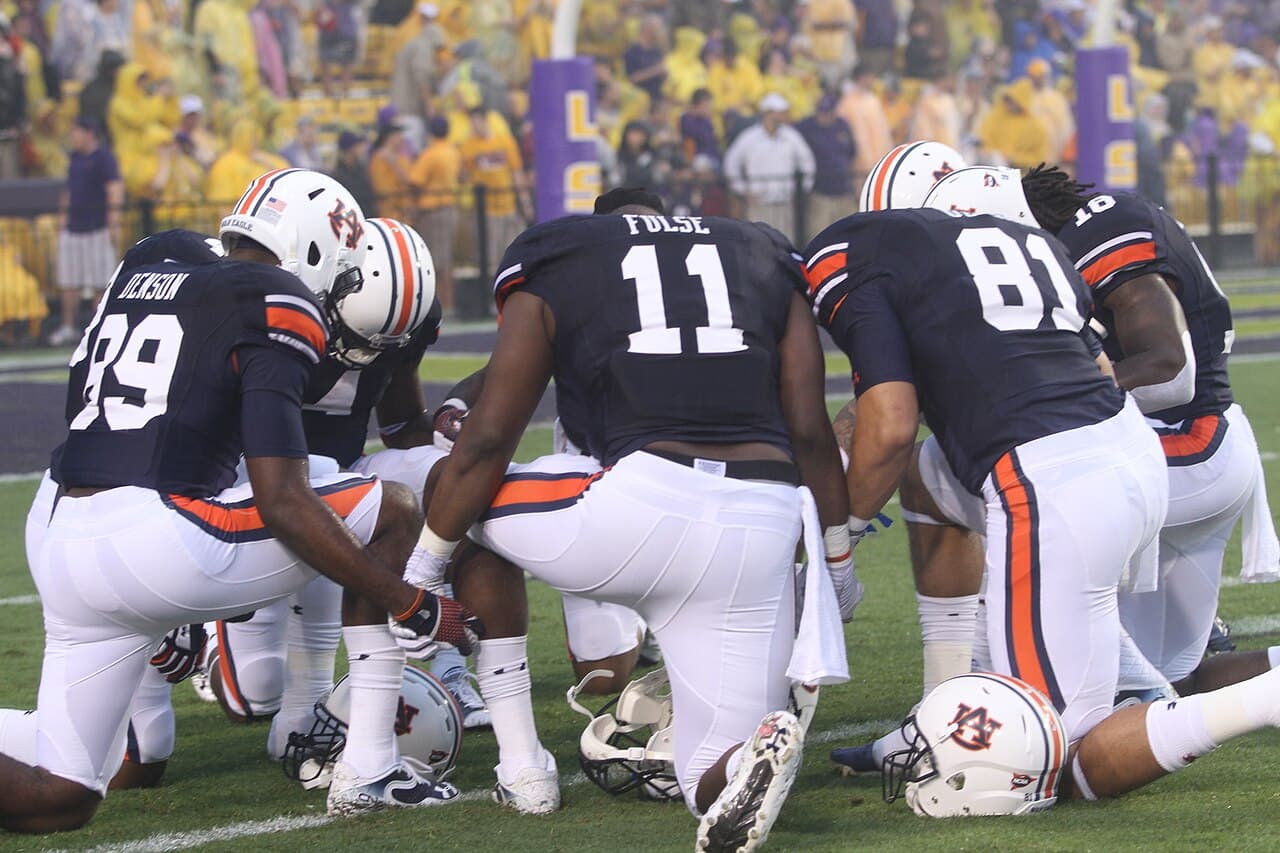 Auburn Tigers take a knee for a pre-game prayer, Tiger Stadium, Baton Rouge, Louisiana, Tammy Anthony Baker,…